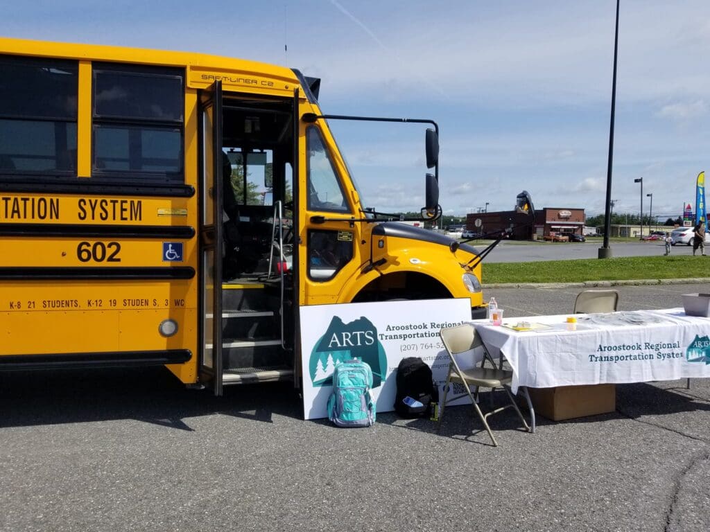 Table step up outside of ARTS yellow school bus